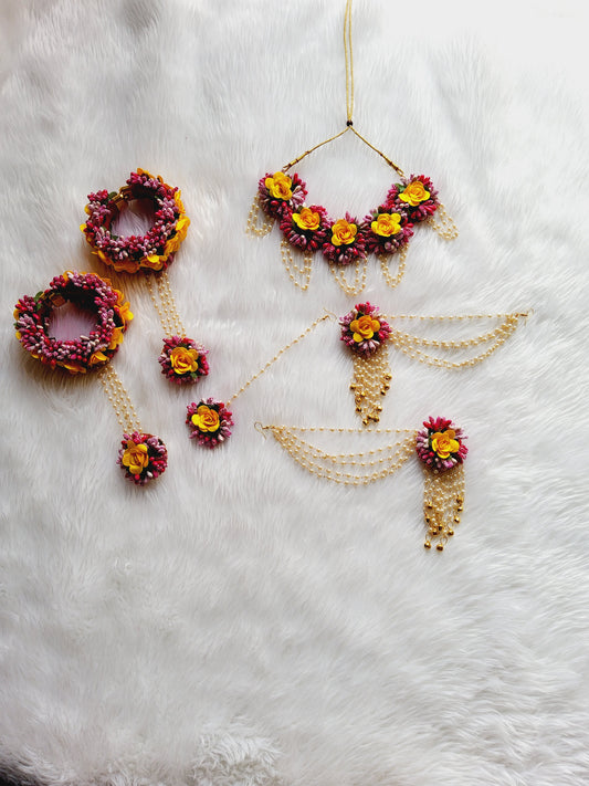 Stunning flower jewellery for Haldi in yellow and rani pink color