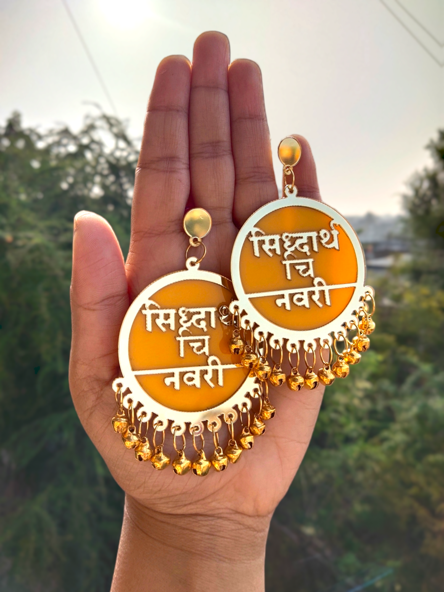 Vibrant yellow Dulhaniya earrings capturing intricate detailing and personalized text in Hindi and Marathi, exemplifying superb craftsmanship and cultural opulence