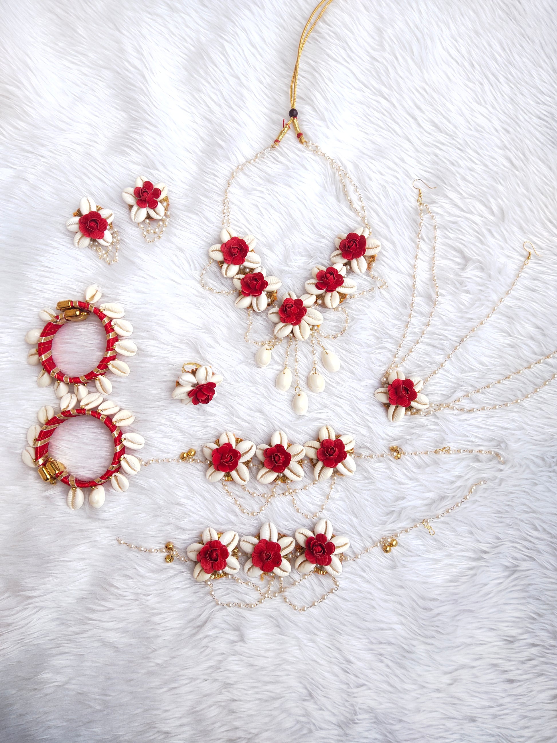 Red shell jewellery that can be worn for haldi ceremonies and baby showers will add a touch of beauty and romance